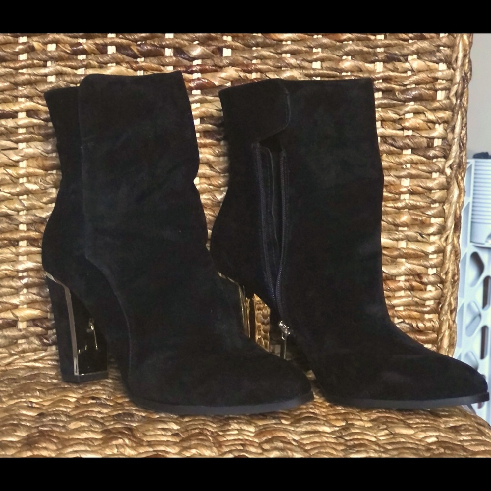 Sassy black high heel bootie with gold trim